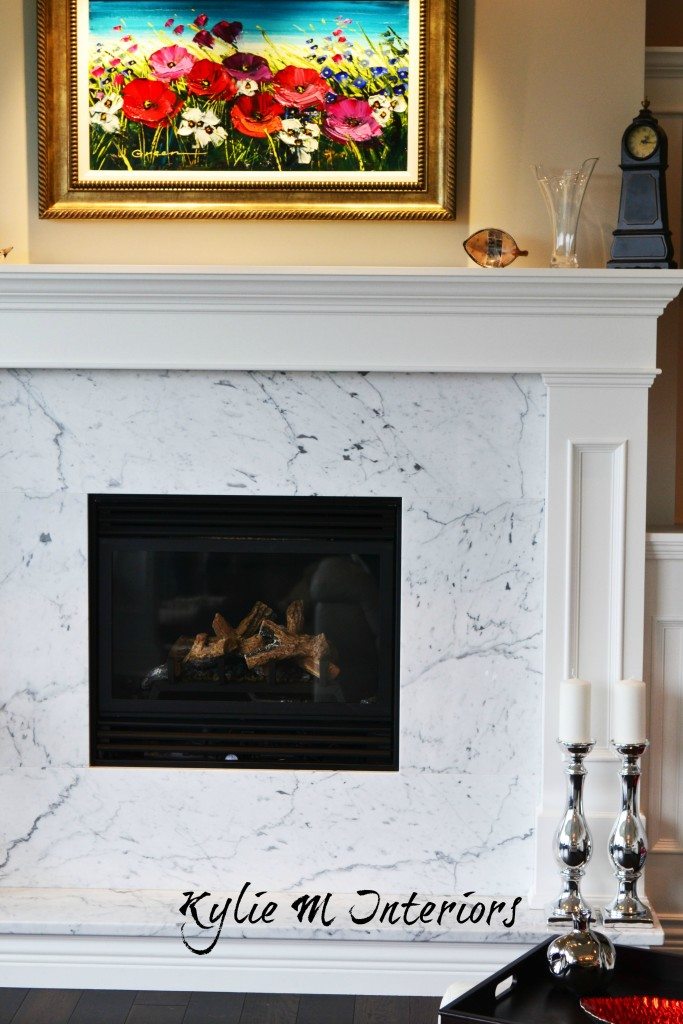 Contemporary or modern style fireplace with white mantel and marble surround