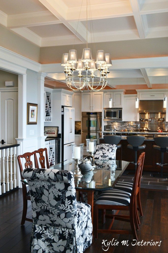 Open concept dining room and kitchen with coffered ceilings and dark wood flooring. Benjamin Moore Stonington Gray and Intense White