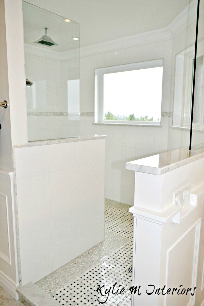 Walk in shower with basket weave mosaic marble tile floor and glass