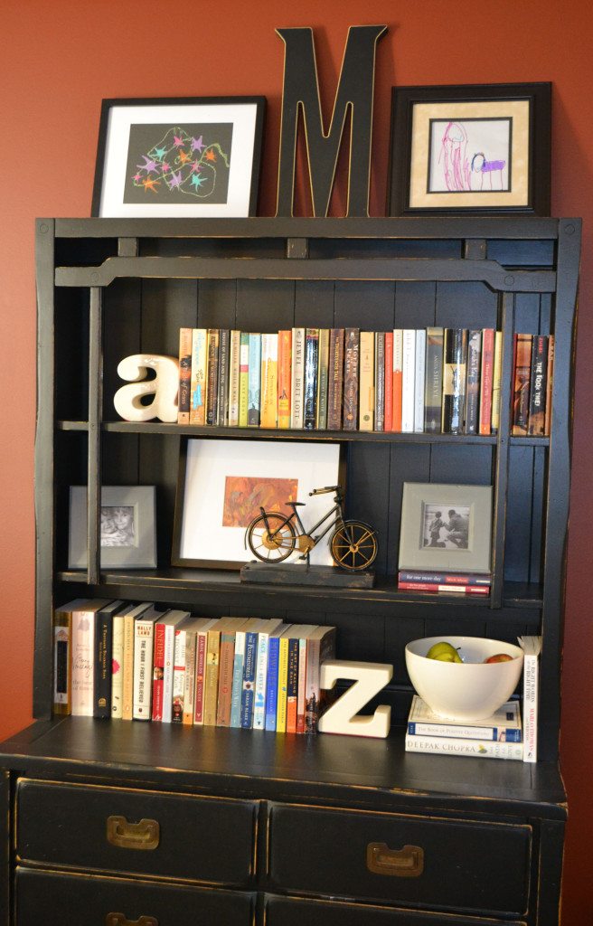 Decorating a bookshelf with books, accessories and artwork