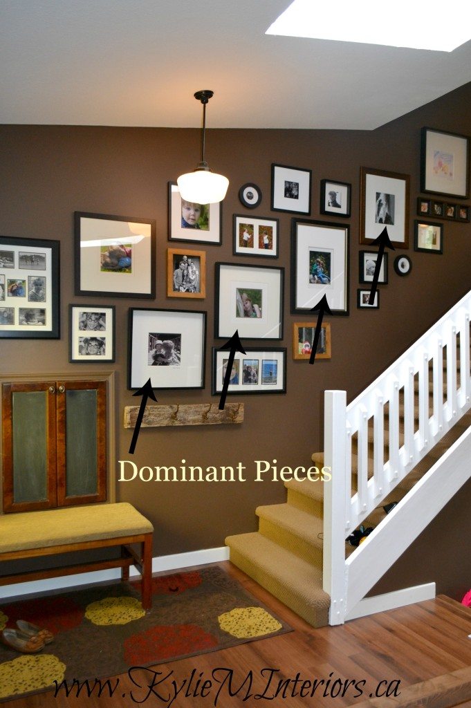 how to hang a photo gallery or artwork display going up stairs or a stairway