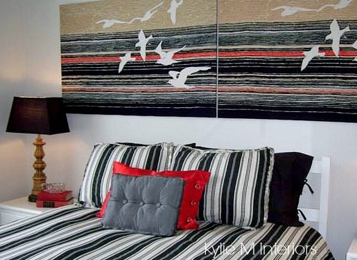 small bedroom with striped bedding and fabric wrapped canvas. Black, red white and gray. Similar to Intense White on the walls. Kylie M Interiors