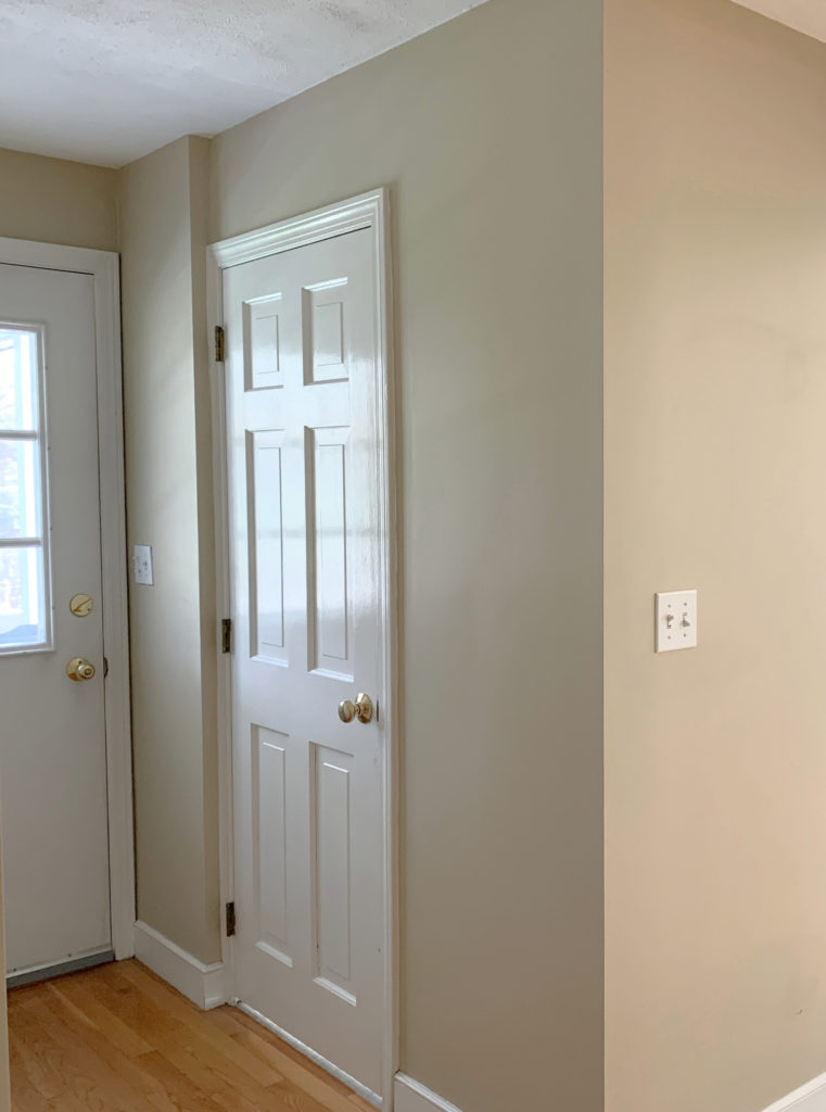 Benjamin Moore Lenon Tan, beige warm neutral paint color on walls, wood floor warm white trim.