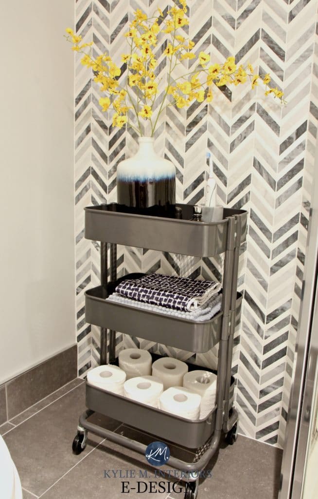 Small bathroom storage idea, ikea Raskog cart. Chevron marble feature tile wall. Kylie M E-design