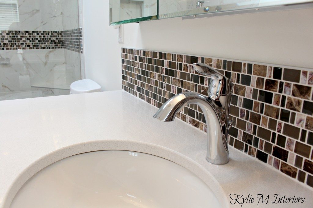 pink and brown marble mosaic tile with white quartz, undermount sink and cloud white paint in bathroom