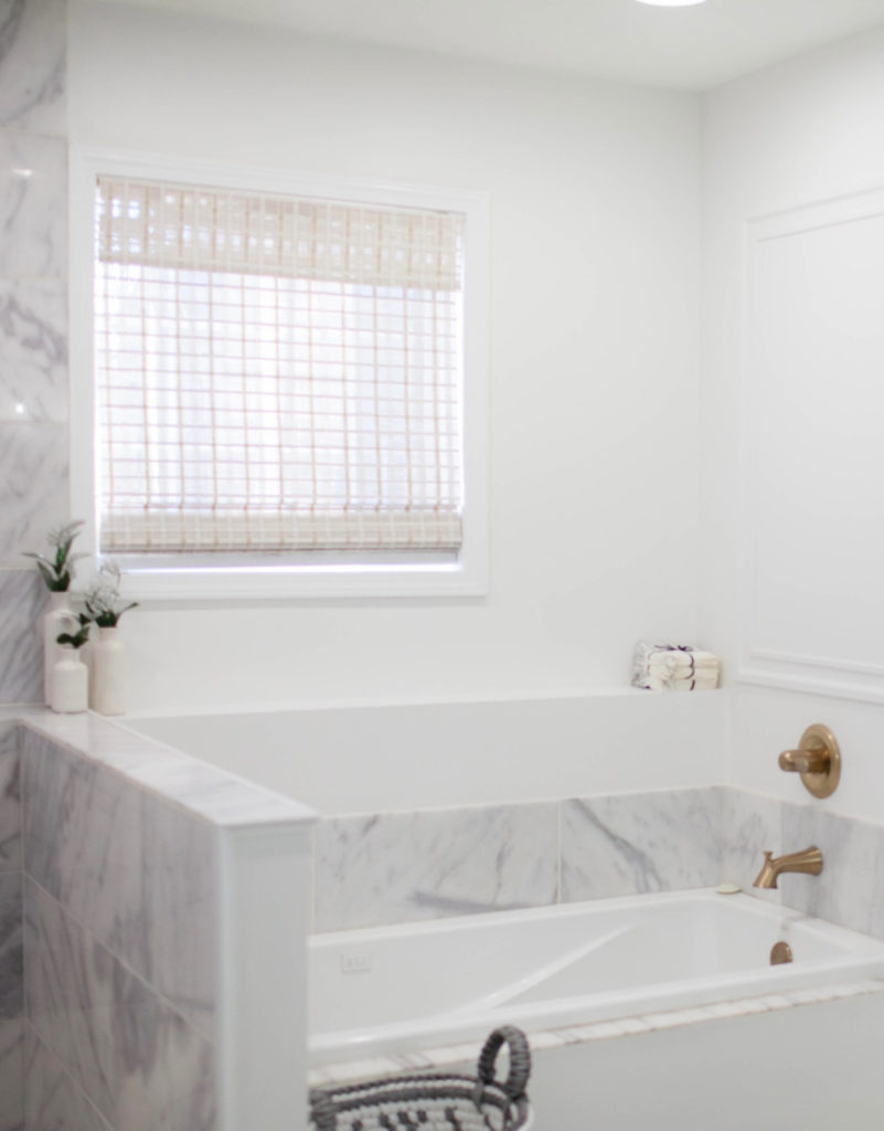 Benjamin Moore Decorators White soft white paint color on walls, marble shower and tub surround. Kylie M Interiors Edesign.