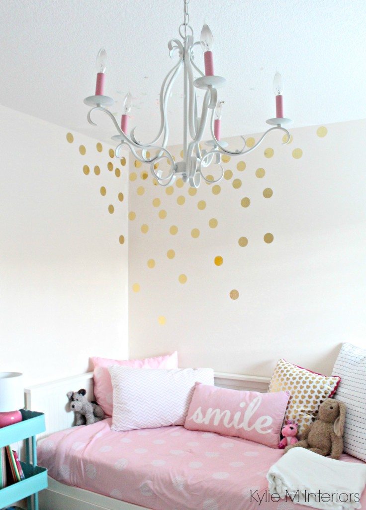 little girls bedroom with pink bliss benjamin moore gold vinyl raindrop decals on the wall with chandelier and decor. cute for a nursery colour palette as well