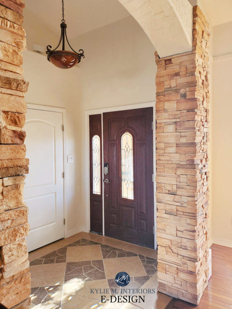 Entryway in Tuscan style home, stone columns, travertine look floor. Warm beige cream paint colour, Sherwin Williams Divine White. Kylie M Edesign, online consultant