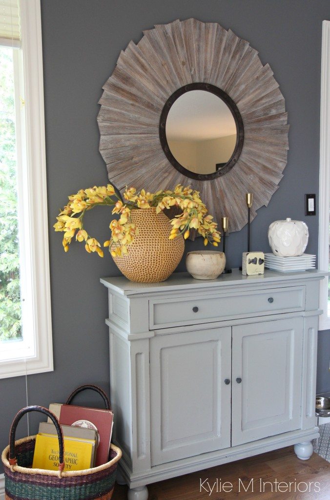 Benjamin Moore Gray, the best paint colour. Country style home decor on a gray painted buffet in dining room with yellow and gold accents and rustic mirror