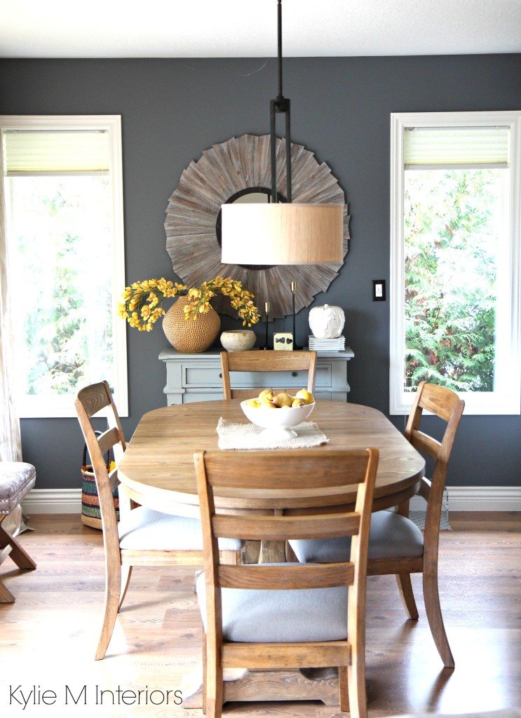 Modern family friendly country farmhouse style dining room. Benjamin Moore Gray with blue and purple undertones and warm oak and wood tones with yellow and gold accents and home decor