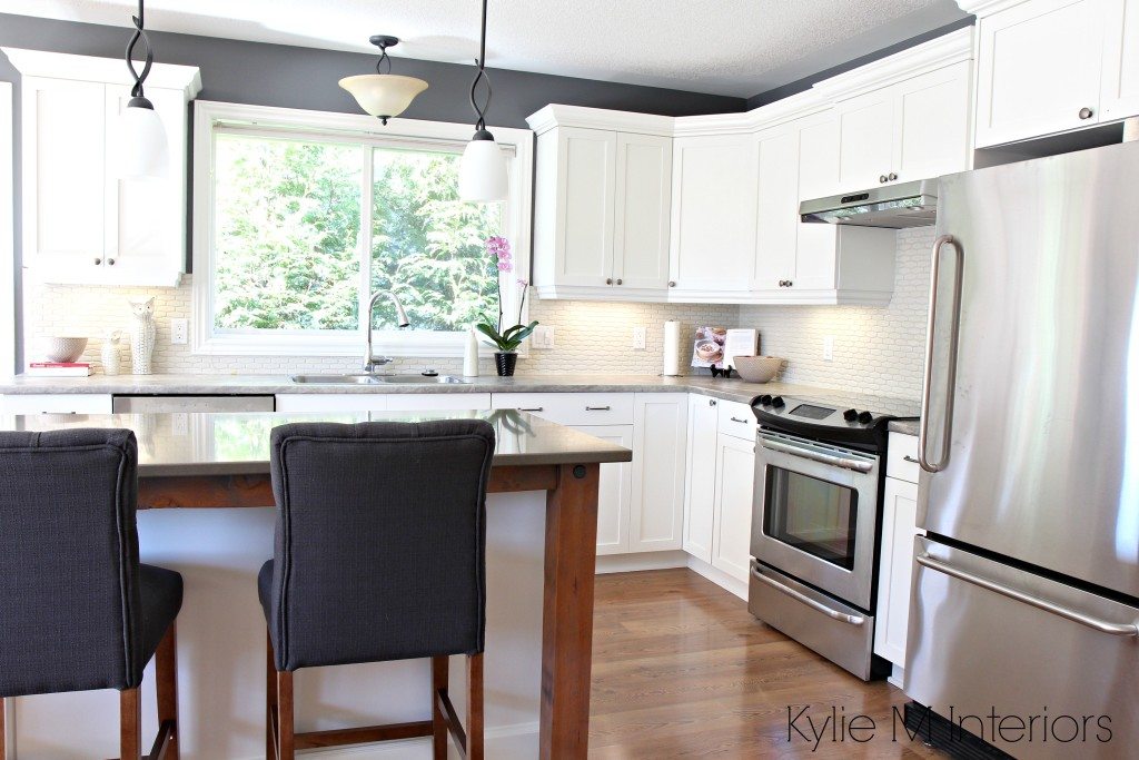 Maple kitchen cabinets painted Cloud White in a makeover with quartz, reclaimed wood and soapstone formica countertops