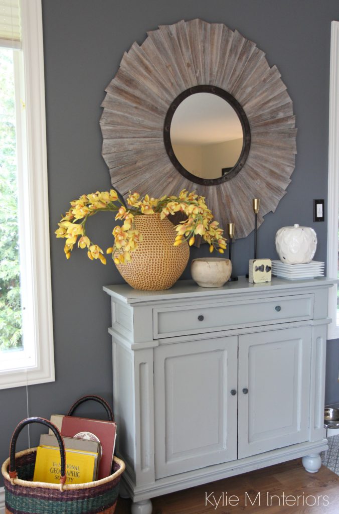 Ideas for how to warm up a gray paint colour in a room. Shown with Benjamin Moore Steel Wool, gray buffet and home decor