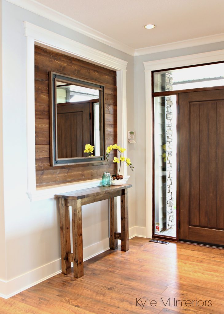 Alcove or niche in entryway wall clad in stained shiplap wood. Benjamin Moore Gray Owl and laminate flooring. Kylie M Interiors e-decor and e-design color consultant