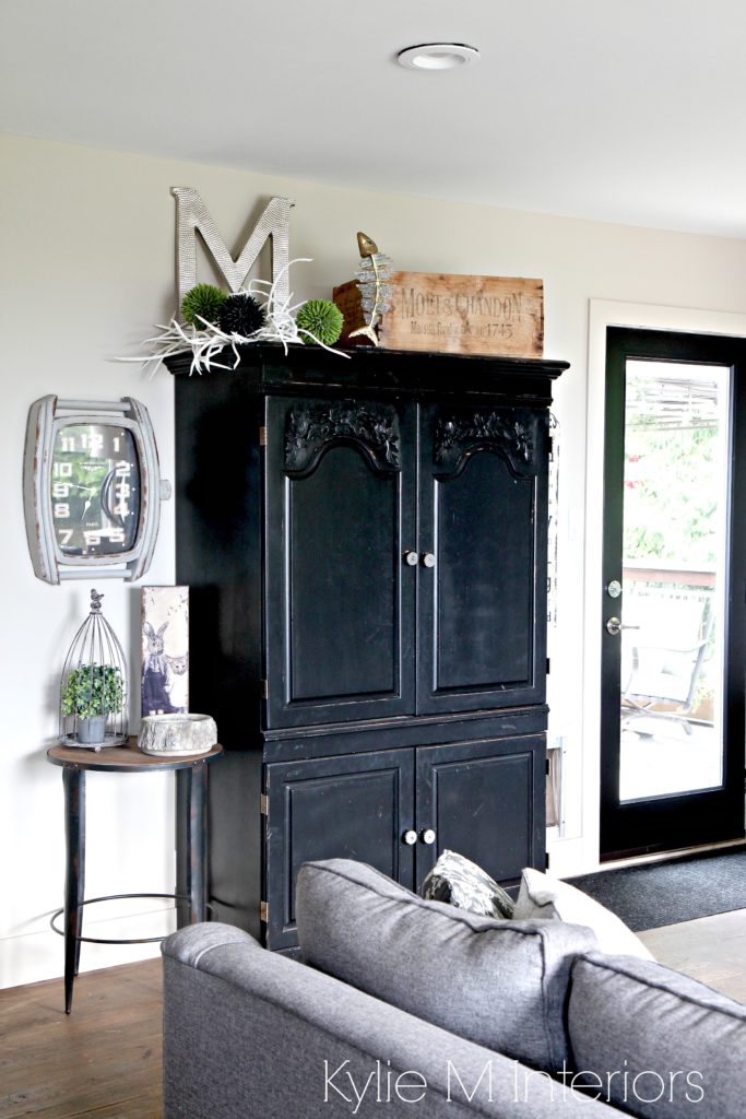 Black painted cabinet with farmhouse and country style decor. Benjamin Moore Grant Beige