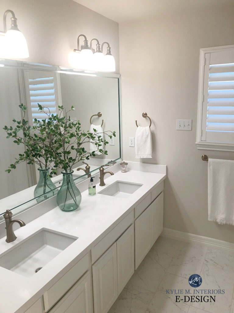Sherwin Williams Egret White, taupe warm gray in bathroom with white vanity, taupe tile floor. Kylie M Interiors Edesign, update and diy home decor ideas