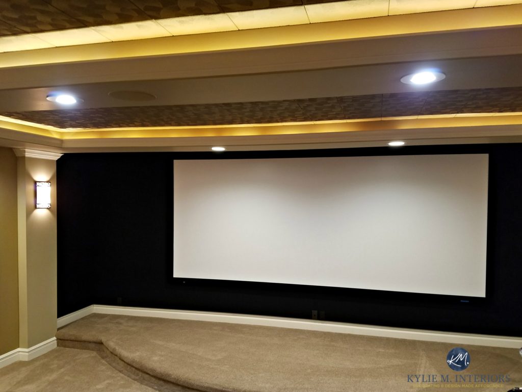 Home theatre room screen with black acoustic fabric, beige carpet by Kylie M Interiors E-design Online Color Consulting
