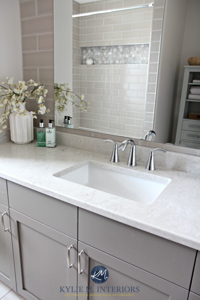Moen Glyde faucet in chrome, Bianco Drift quartz by Caesarstone, Benjamin Moore Metropolis painted vanity and gray subway tile shower by Kylie M Interiors