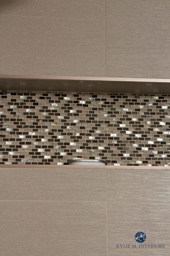 Close up of mosaic tile niche in shower with mother of pearl and large greige porcelain wall tile. Kylie M Interiors Decorating and Design blog