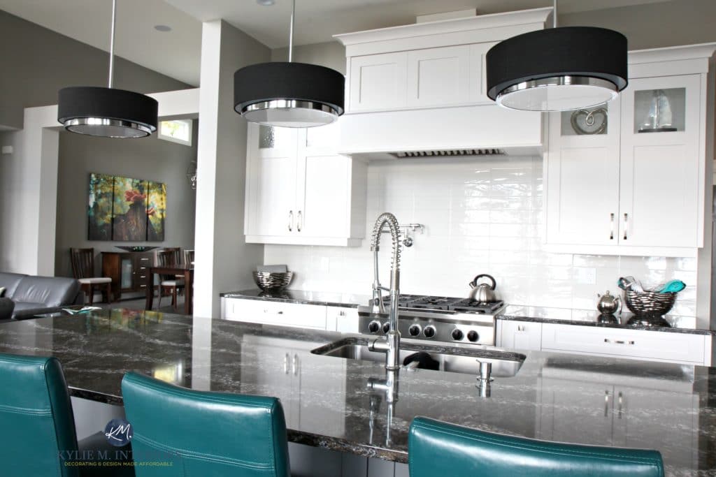 High contrast white contemporary kitchen with black granite and white cabinets. Kylie M Interiors