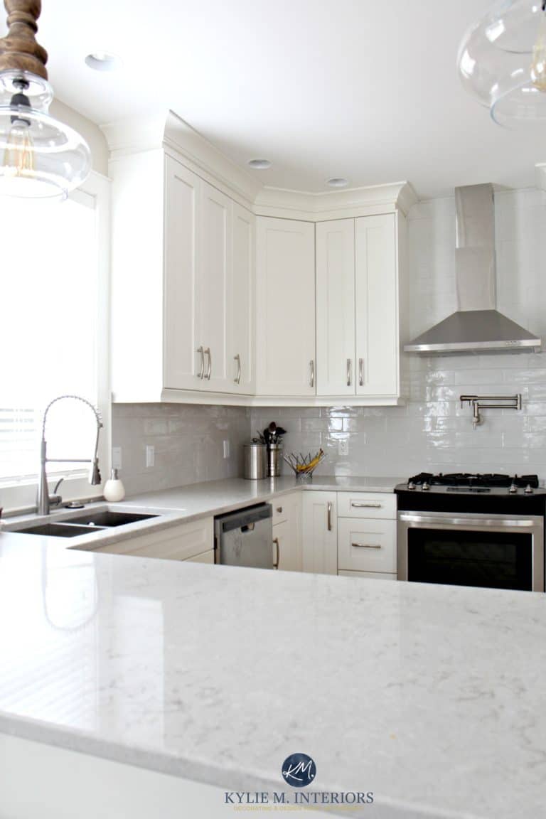 Low contrast white kitchen with Bianco Drift quartz countertops and