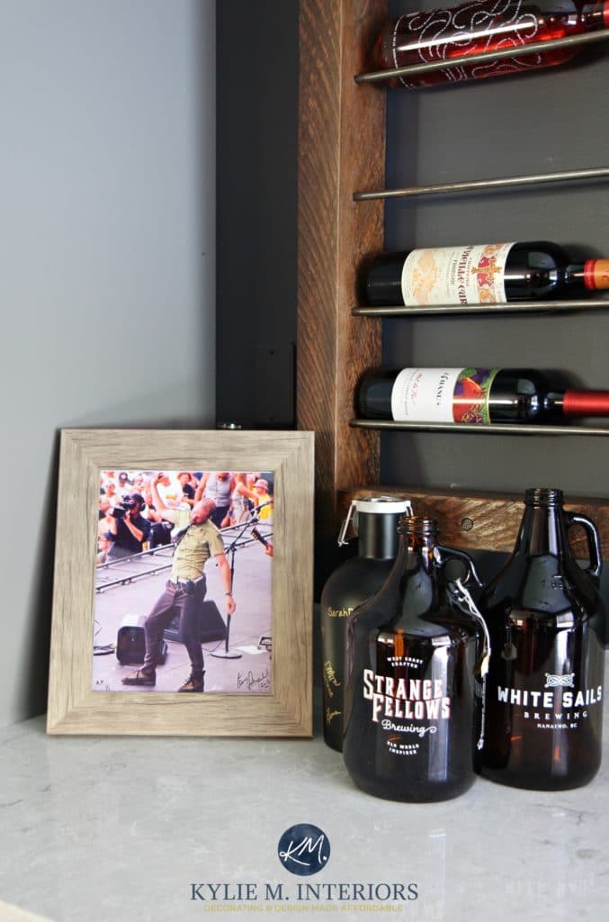 Home bar with wine wall display, growlers and a photo of Gord Downey. Kylie M Interiors E-design