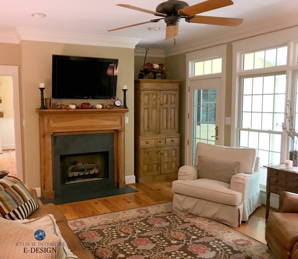 Benjamin Moore Lenox Tan, warm beige paint colour in living room with pine mantel and wood flooring, furniture. Country, farmhouse style. Autumn or fall palette