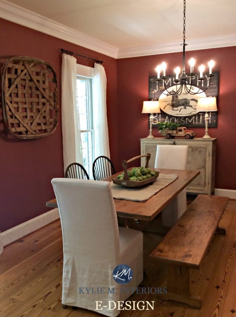 Benjamin Moore Onondaga Clay, Boxcar Red in farmhouse country style dinign room with wood floor, table and chandelier. Kylie M Interiors E-design and online color consulting and e-decor expert