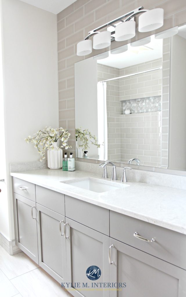 East facing room with paint colour.Bathroom remodel, Moen Glyde fixtures, Bianco Drift quartz countertop Caesarstone, subway tile wall, Gray painted vanity by Kylie M Interiors E-design
