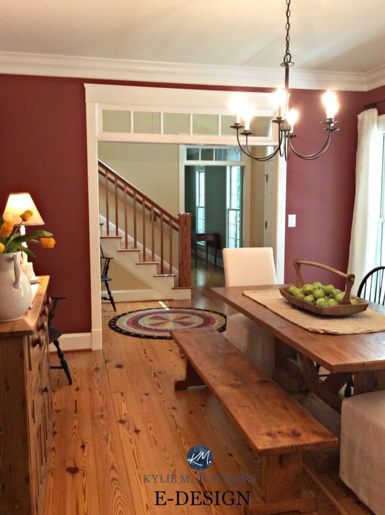 Farmhouse style dining room, Benjamin Moore Onondaga Clay, Boxcar Red, Powell Buff going up the stairs with pine floor and oak buffet. Kylie M Interiors E-design, online color expert