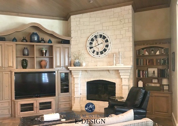 Large clock on limestone fireplace with 