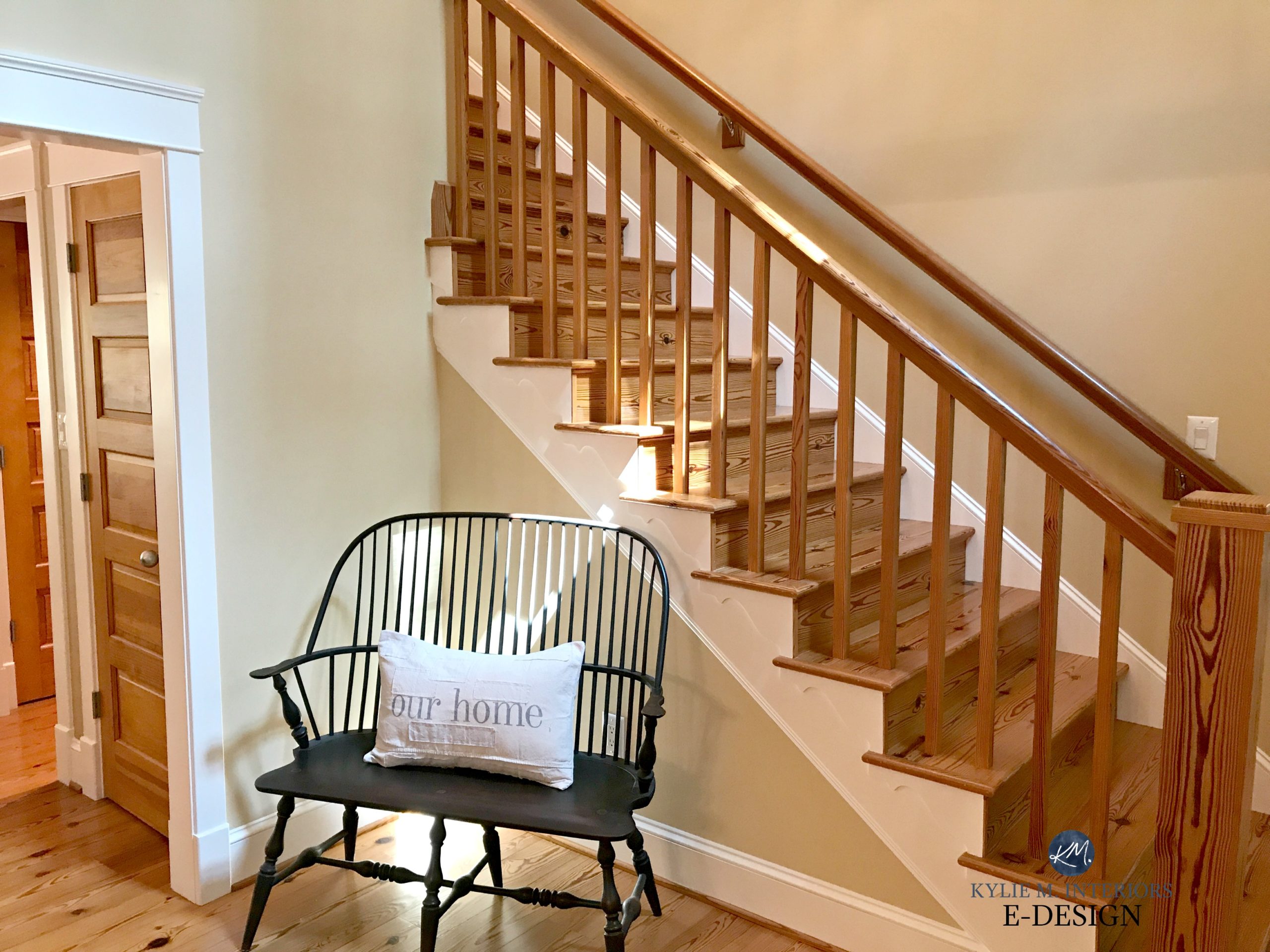 Pine and warm toned wood floor, doors, stairs and railings. Similar to oak look. Benjamin Moore Powell Buff, warm beige paint colour. Kylie M E-design, online, virtual colour consulting services