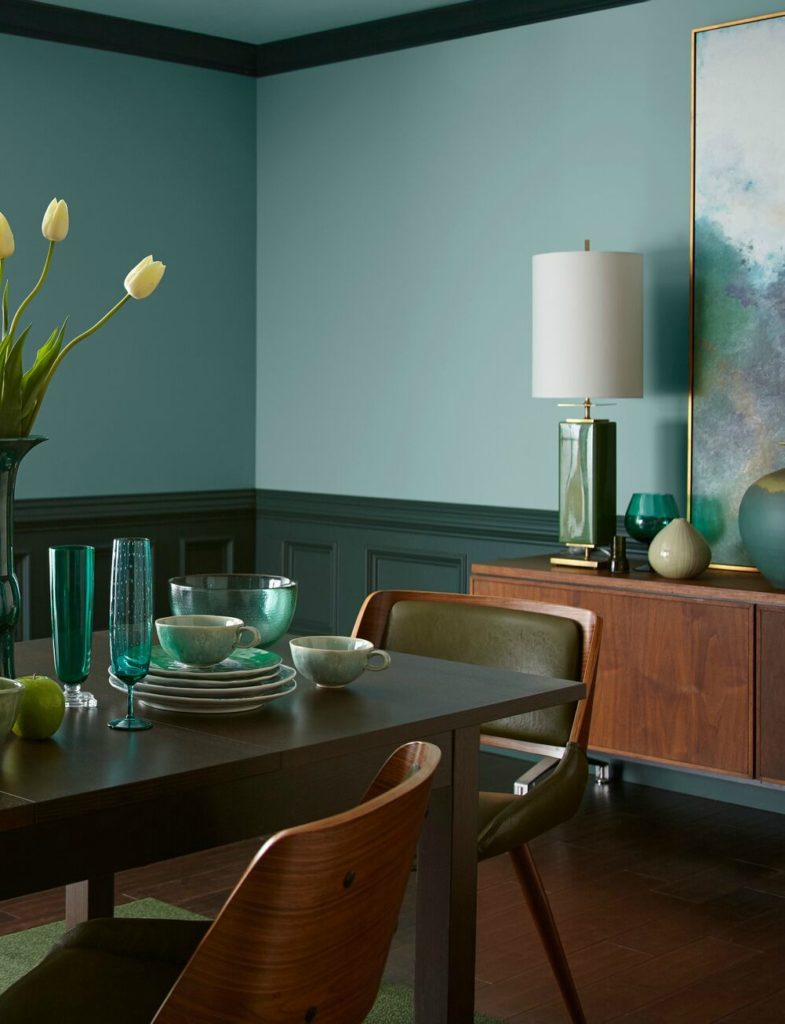 Behr In the Moment in a diningroom with dark wood, painted wainscoting. 2018 colour year. Photo via Behr, info via Kylie M Colour blog.