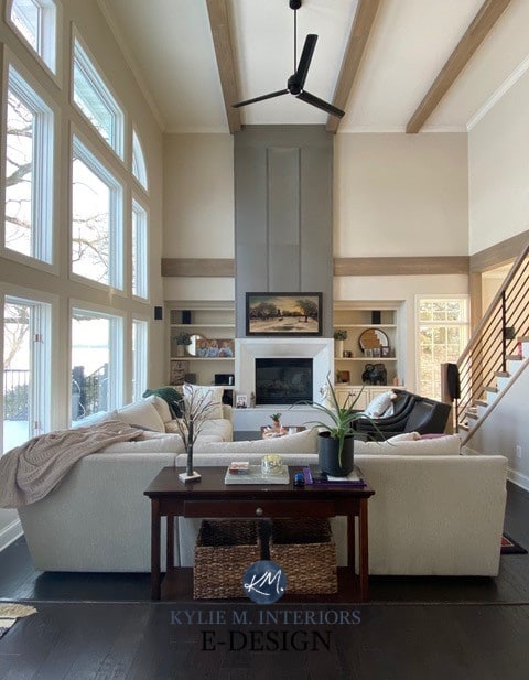 Sherwin Williams Natural Tan, living room wood beams, vaulted ceiling, fireplace, beige sectional, dark wood floors. Kylie M Interiors Edesign, online paint colour consulting