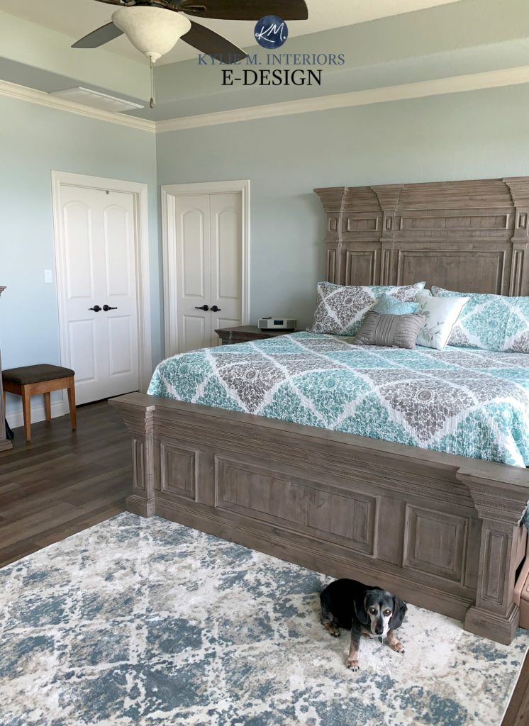 Sherwin Williams Silver Strand, master bedroom with wood headboard and footboard and floor with white trim. Kylie M Interiors Edesign, online paint color consulting
