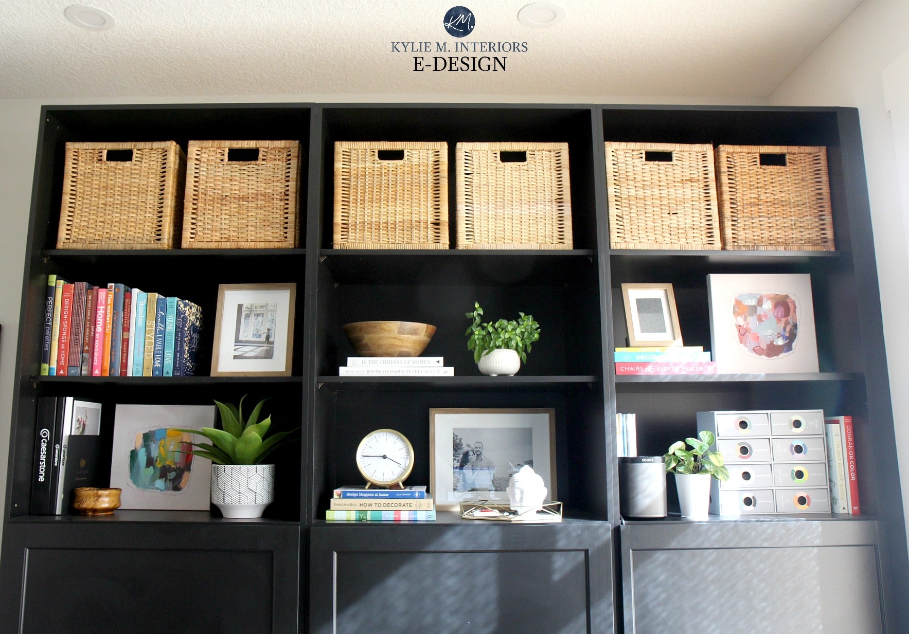 How to decorate a bookcase, bookshelf or built in. Black painted built in with home decor, books and frames. Kylie M Interiors Edesign, diy decorating and design blog