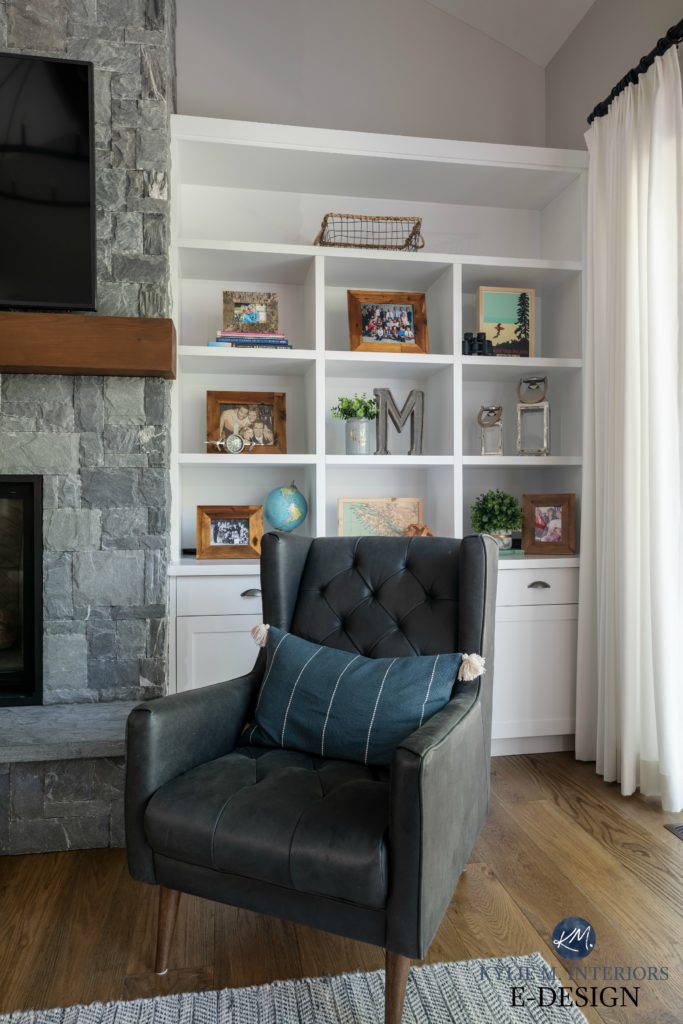 K2 stone fireplace with white built in cabinets, gray leather chair, oak flooring and living room home decor. Kylie M INteriors Edesign, online paint colour consulting. Gray paint colour on walls