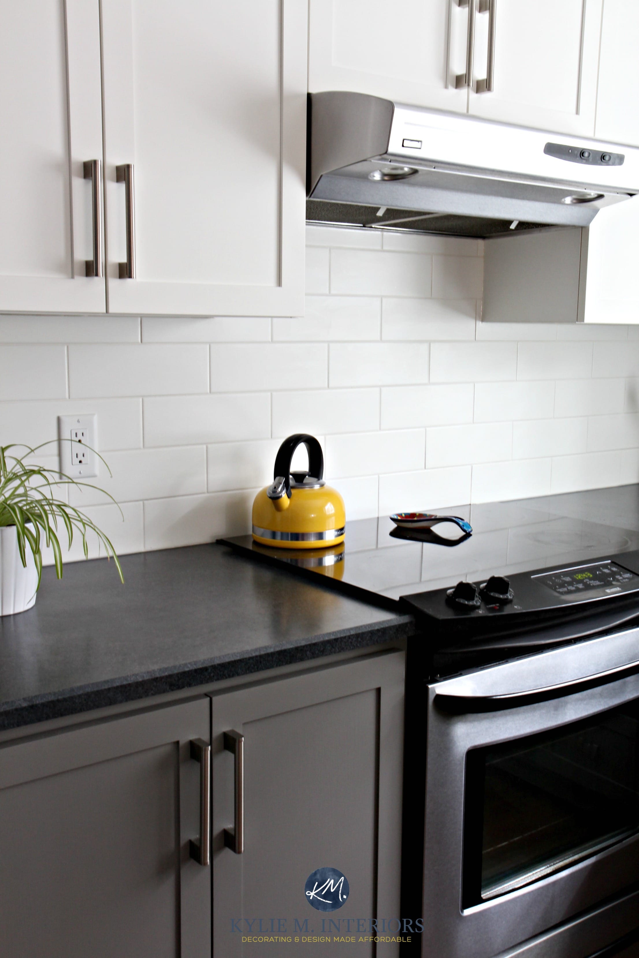 Kitchen with Chelsea Gray, subway tile, black laminate countertop