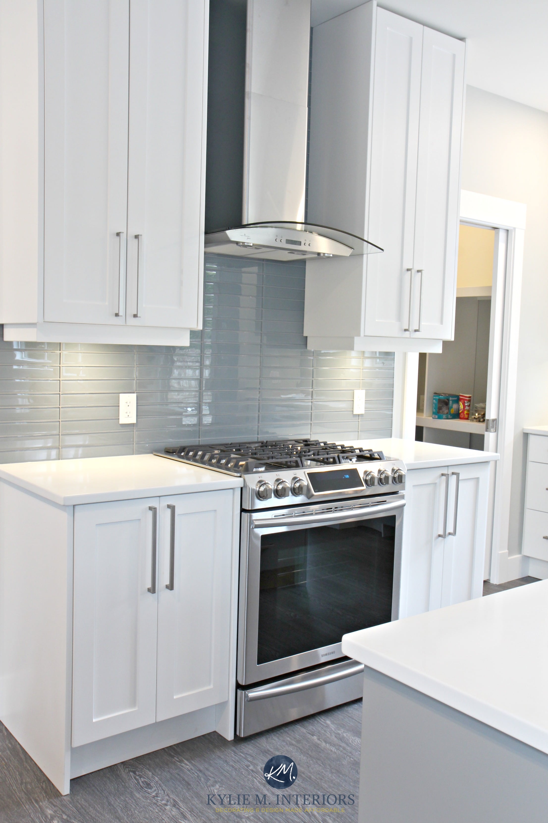 White shaker style cabinets, white quartz countertops, Coventry Gray