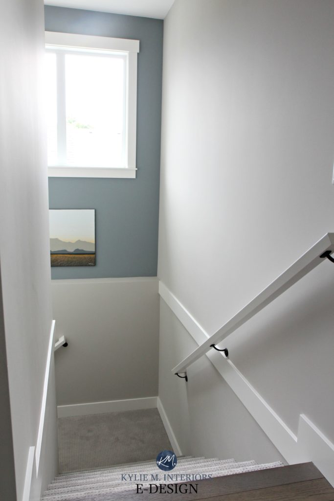 Stairwell with gray carpet and Sherwin Williams Collonade Gray, lightened by 25%. Benjamin Moore Gibraltar Cliffs feature wall. Kylie M INteriors Edesign