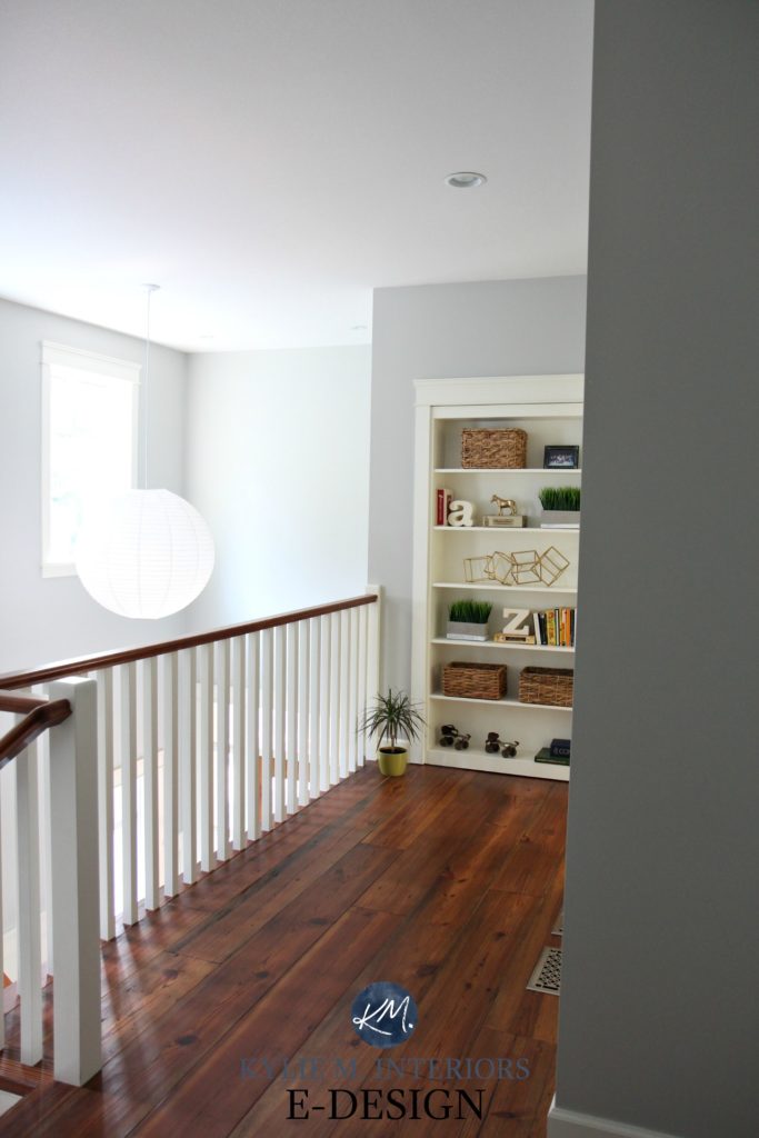 Hallway with reclaimed wood flooring and white railling. Benjamin Moore Gray Owl and built in bookcase. Kylie M Interiors Edesign, online paint color