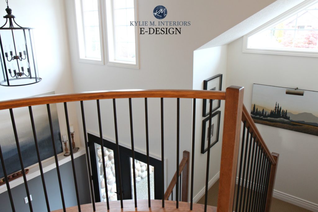 2 storey entryway, foyer with curved stair rail, wood and black metal, Sherwin Williams Creamy on walls. Kylie M Interiors edesign, virtual design consulting