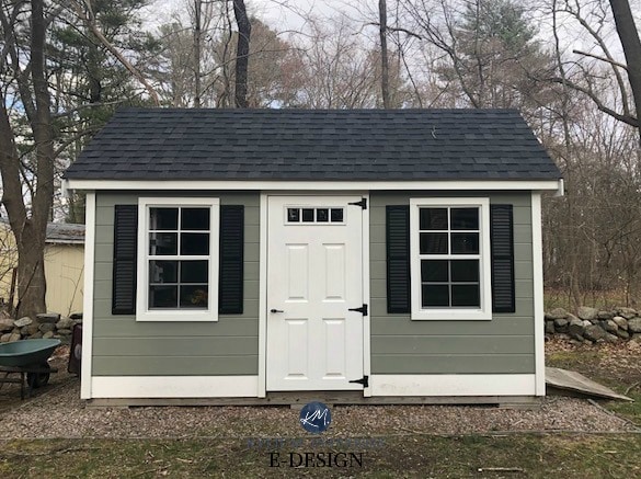 Exterior house, garage, shed Benjamin Moore Storm Cloud Gray, Cloud White Trim, Tricorn Black shutters, dark charcoal roof. Client photo. Kylie M INteriors Edesign