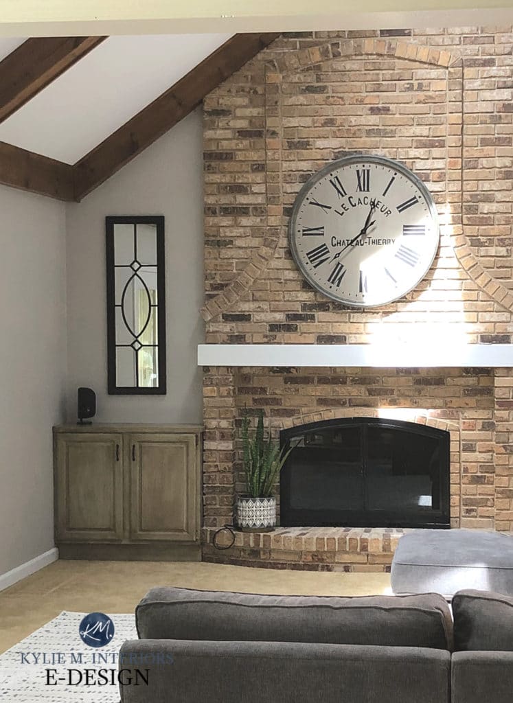 Sherwin Williams best warm gray greige paint color, Colonnade. Brown brick vaulted fireplace in living or family room. Kylie M Interiors Edesign, online paint colour advice