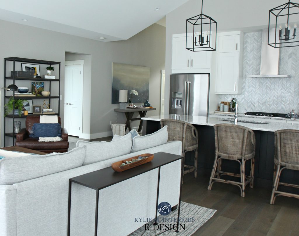 Open layout great room. Kylie M INteriors edesign. Sherwin Williams Collonade Gray. Transitional home decor and rattan bar stools - Copy