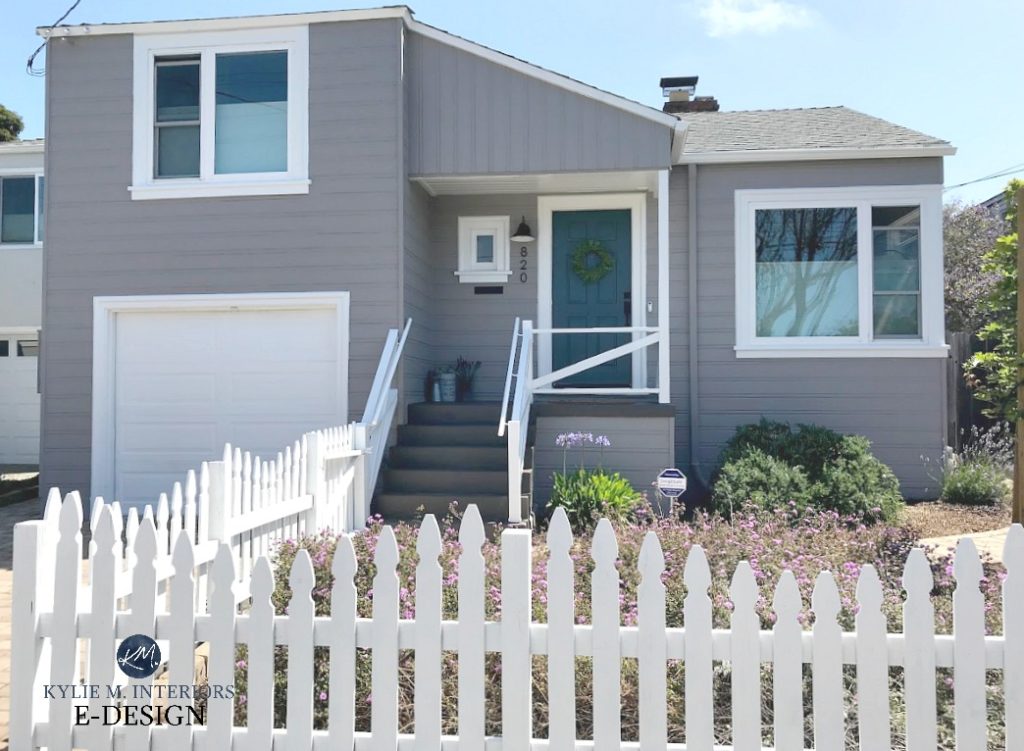 Exterior painted Sherwin Williams Still Water, Polished Concrete siding, Pure White trim, gray paint colour, white trim, blue green front door dark warm gray stairs and white picket fence. Kylie M INteriors Edesign, online paint colour advice blog