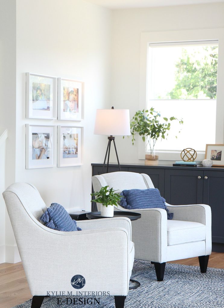 Kylie M Interiors, edesign, online paint colour consultant. Living room with gray accent chairs, Pure White walls and trim, gallery wall and navy blue builtins