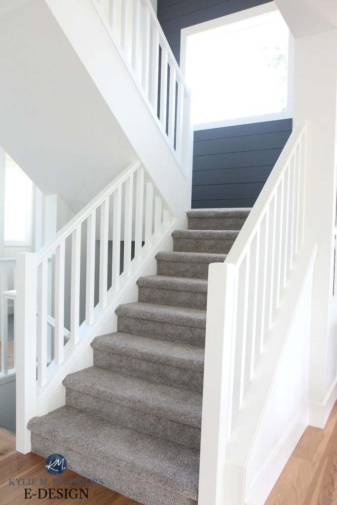 Staircase, greige warm gray carpet, white railing, shiplap feature wall in stairwell Sherwin Williams Web Gray, Pure White trim, walls. Kylie M INteriors Edesign, online paint colour expert, advice
