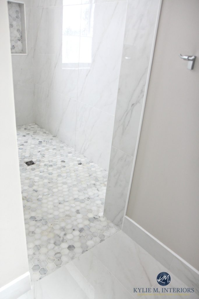 Walk in shower with marble hexagon tile floor, marble walls, baseboard and flooring. Kylie M Interiors Decorating, Design, Online Color Consulting