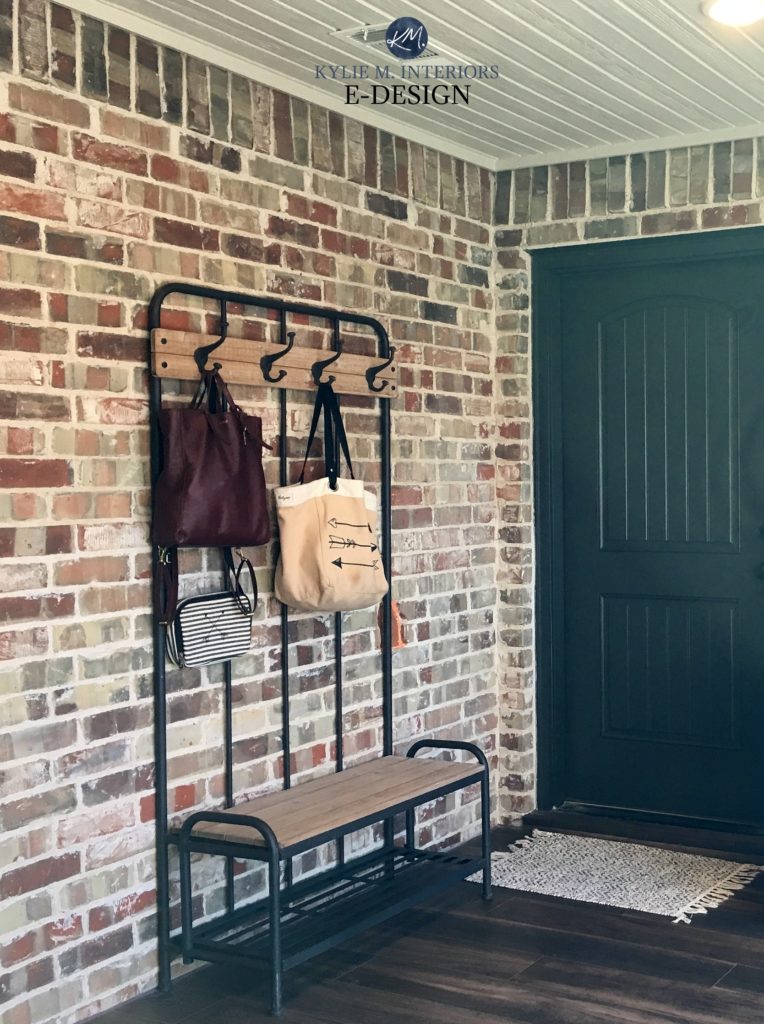 Exposed brick wall in entryway area with black door and wood flooring. Kylie M Interiors Edesign, consultant for best paint colours from Benjamin Moore and Sherwin online