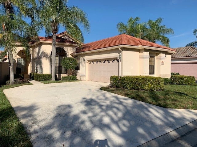 Exterior, red terra cotta roof, stucco before being painted with Kylie M Interiors Edesign